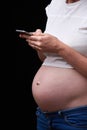 pregnancy, motherhood, technology, people and expectation concept - sad pregnant woman calling on smartphone at home. upset Royalty Free Stock Photo