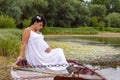 Pregnancy and Nature concept. New life. Pregnant woman resting o Royalty Free Stock Photo