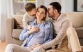 Happy family with pregnant mother at home Royalty Free Stock Photo