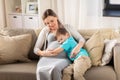 Happy pregnant mother and son hugging at home Royalty Free Stock Photo