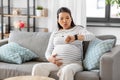 pregnant woman having labor contractions at home