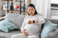 pregnant woman having labor contractions at home