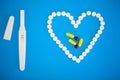 Pregnancy test. The result is positive with two strips. Treatment of infertility with pills, help in conceiving a child. Tablets