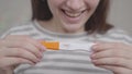 pregnancy test result two strips in hands of happy woman, the joy of motherhood in anticipation of a future life with a Royalty Free Stock Photo