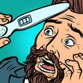 Pregnancy test. scared bearded hipster man husband father