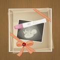 Pregnancy test and ultrasound in the gift pack Royalty Free Stock Photo