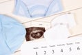 Pregnancy test, ultrasound scan of baby, clothing for newborn and calendar, expecting for baby Royalty Free Stock Photo