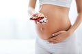 Pregnancy Vitamins And Medications. Pregnant Woman With Pills Royalty Free Stock Photo