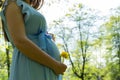Pregnancy walking woman. Baby belly. Pregnant walk nature. Happy maternity mother in summer park. Active pregnancy. Royalty Free Stock Photo