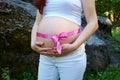 Pregnancy women and rose ribbon