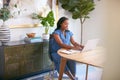 Pregnant African American Woman Using Laptop At Table Working From Home Royalty Free Stock Photo