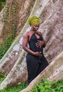 Pregnant african tribal woman standing in forest Royalty Free Stock Photo
