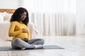 Pregnant african woman doing sport at home Royalty Free Stock Photo