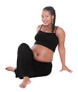 Pregnant African woman sitted doing yoga sports