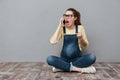 Pregnant angry screaming woman talking by mobile phone. Royalty Free Stock Photo
