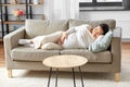 pregnant asian woman sleeping on sofa at home Royalty Free Stock Photo