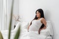 Pregnant asian woman suffering from back pain Royalty Free Stock Photo