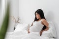 Pregnant asian woman suffering from back pain Royalty Free Stock Photo