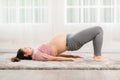 Pregnant Asian young woman breathing meditation with yoga Half Bridge pose,Yoga meditation of young healthy pregnant woman relax Royalty Free Stock Photo