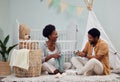 Pregnant and baby room and black couple happy to prepare for a family home and folding clothes. Man and woman together Royalty Free Stock Photo