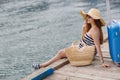 Pregnant beautiful woman on the pier at the sea Royalty Free Stock Photo