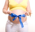 Pregnant belly with blue stripe and bowknot