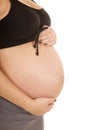 Pregnant belly close side hand over under Royalty Free Stock Photo