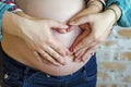 Pregnant belly couple hands heart Royalty Free Stock Photo