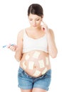 Pregnant belly and sticker notes, woman planning rasks, reminder Royalty Free Stock Photo