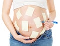 Pregnant belly and sticker notes, woman planning, reminder Royalty Free Stock Photo