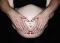 Pregnant belly stomach maternity heart hands Royalty Free Stock Photo