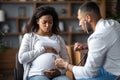 Pregnant black woman feeling bad, visiting doctor Royalty Free Stock Photo