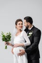 Pregnant bride looking at muslim groom Royalty Free Stock Photo