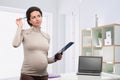 Pregnant business woman in the office Royalty Free Stock Photo