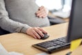 Pregnant businesswoman with computer at office Royalty Free Stock Photo