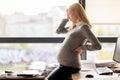 Pregnant businesswoman feeling sick at office work Royalty Free Stock Photo