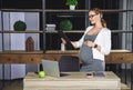 Pregnant businesswoman. Pregnant mature businesswoman working at office Royalty Free Stock Photo