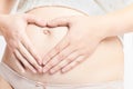 Pregnant caucasian mother with hands on belly Royalty Free Stock Photo