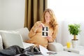 Pregnant caucasian woman resting at home. A young expectant mother reads a doctor's report Royalty Free Stock Photo