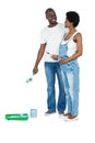 Pregnant couple with blue paint tin Royalty Free Stock Photo