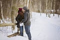 Pregnant couple have fun in winter nature Royalty Free Stock Photo