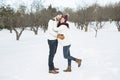 Pregnant couple have fun in winter nature Royalty Free Stock Photo