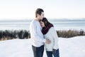 Pregnant couple have fun in winter nature Royalty Free Stock Photo