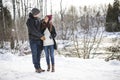 Pregnant couple have fun in winter nature Royalty Free Stock Photo