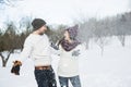 Pregnant couple have fun in winter nature Royalty Free Stock Photo