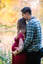 Pregnant couple outdoors in autumn Royalty Free Stock Photo