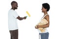 Pregnant couple painting with paint roller Royalty Free Stock Photo