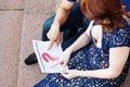 Pregnant couple plans a date of baby birth with the calendar. Royalty Free Stock Photo