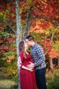 Pregnant couple portrait outdoors in autumn Royalty Free Stock Photo