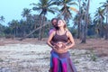 Pregnant couple walking on the beach